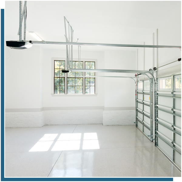 clean, empty garage with opener mounted on ceiling