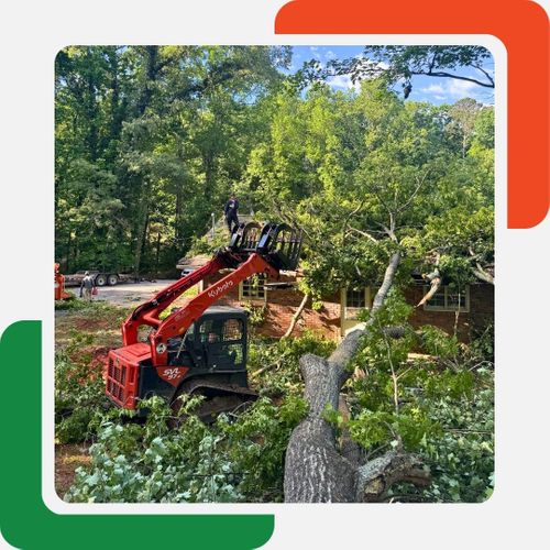 A red Kubota SVL 97-2 track loader with a grapple attachment is positioned next to a large, fallen tree trunk, surrounded by many cut branches. A red Kubota SVL 97-2 track loader with a grapple attachment is positioned next to a large, fallen tree trunk, surrounded by many cut branches.