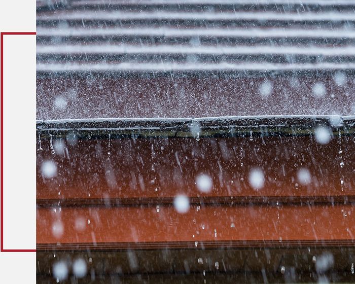 Heavy rain falling onto roof