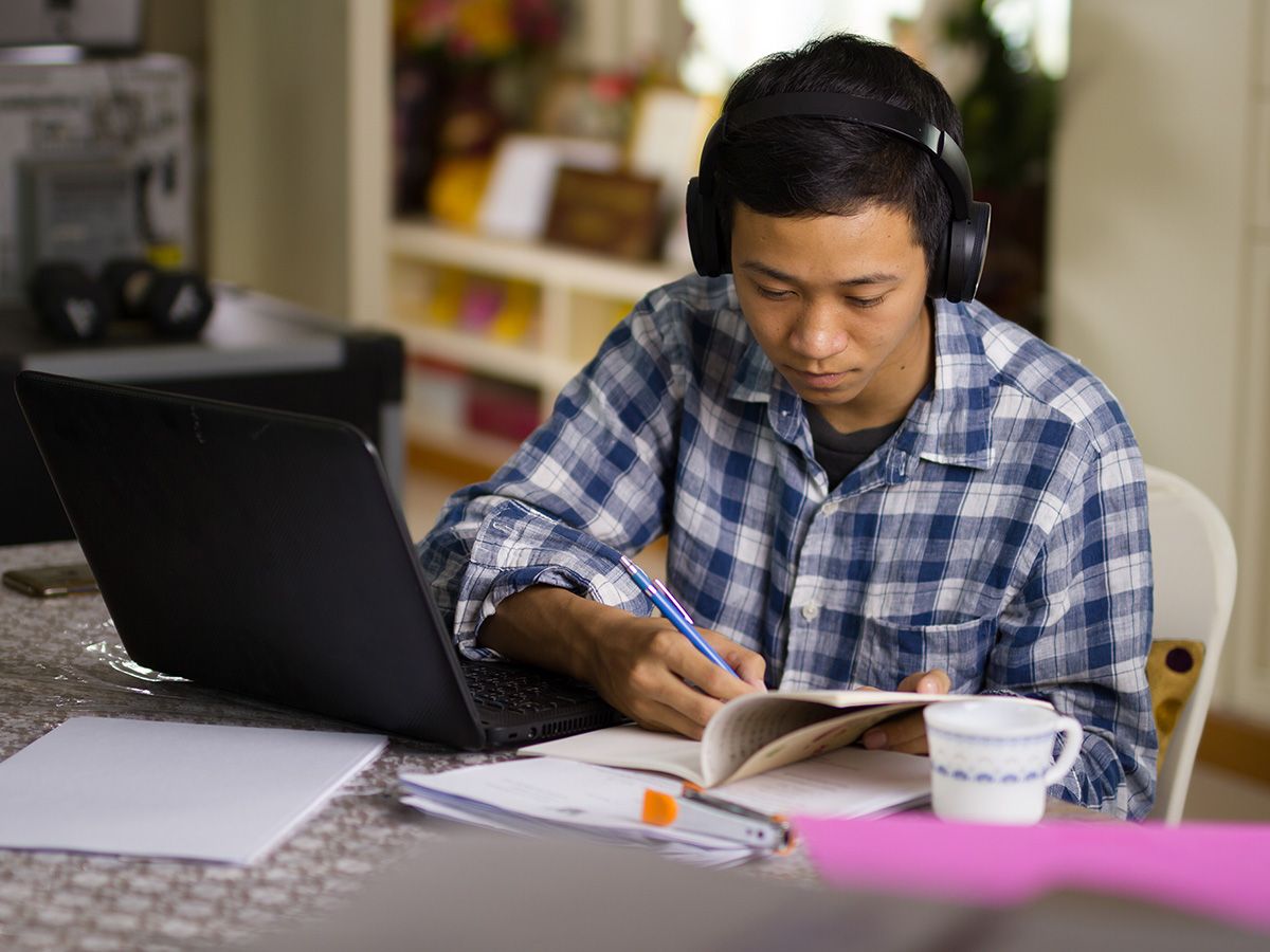 photo of boy focusing on his studies