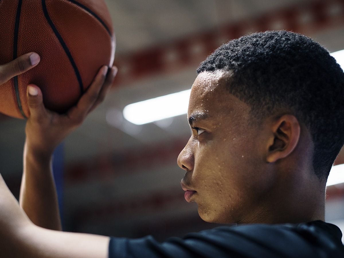 Image of a student getting ready to shoot a basketball