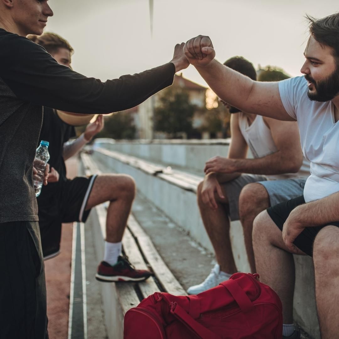 Friends congratulating each other on a good game