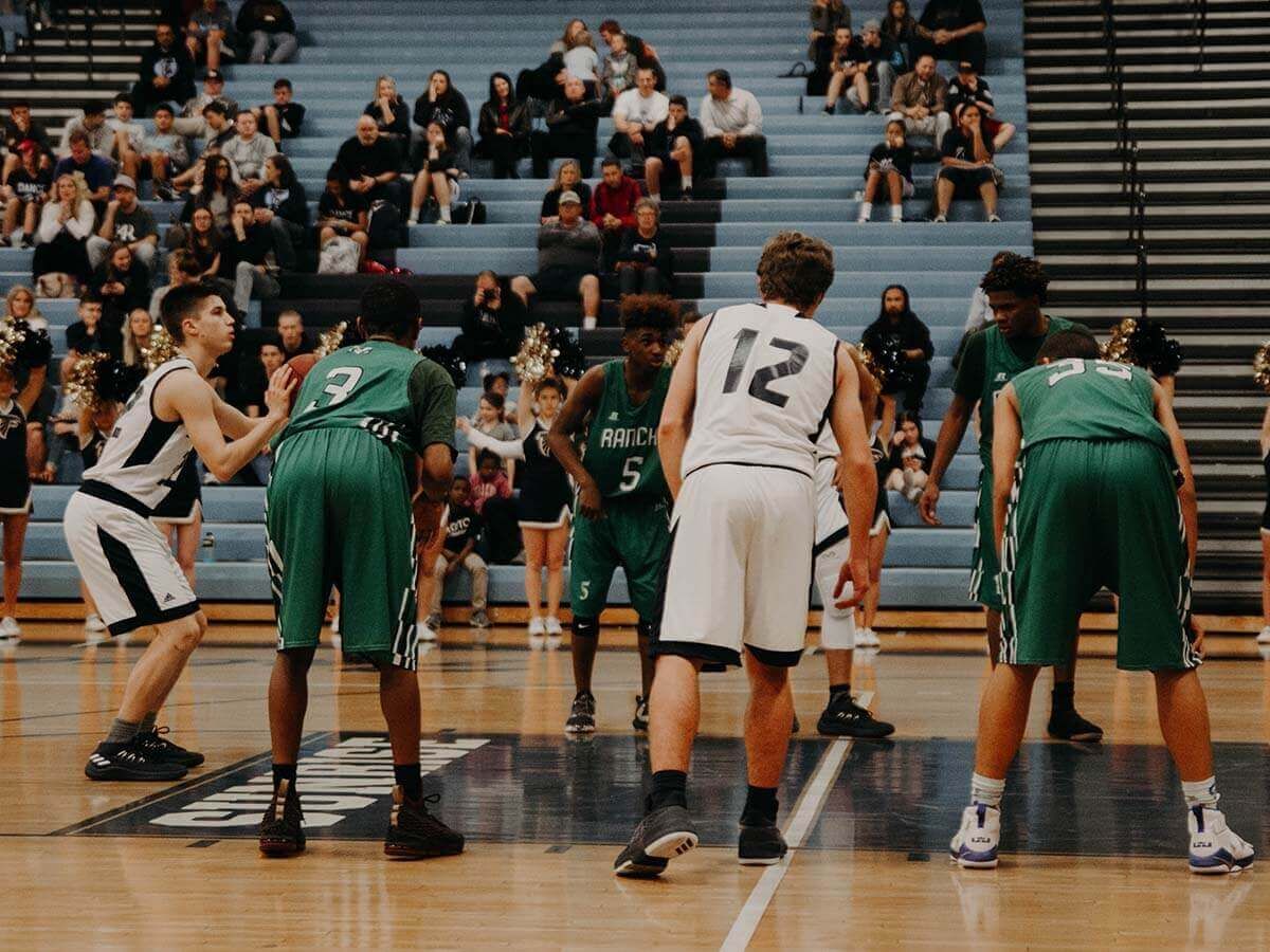 A student athlete taking a free throw at a basketball game.