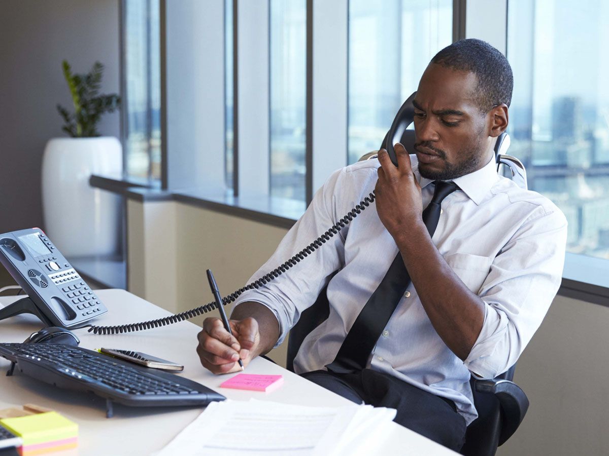 A sports manager on a call