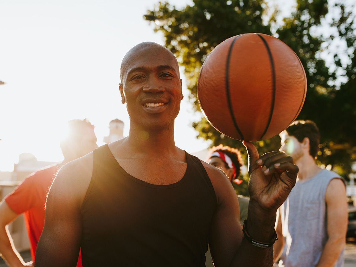 Image of a man holding a basketball