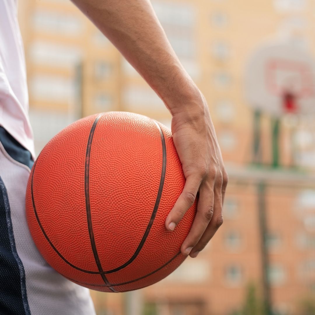 a player holding a basketball in his hand