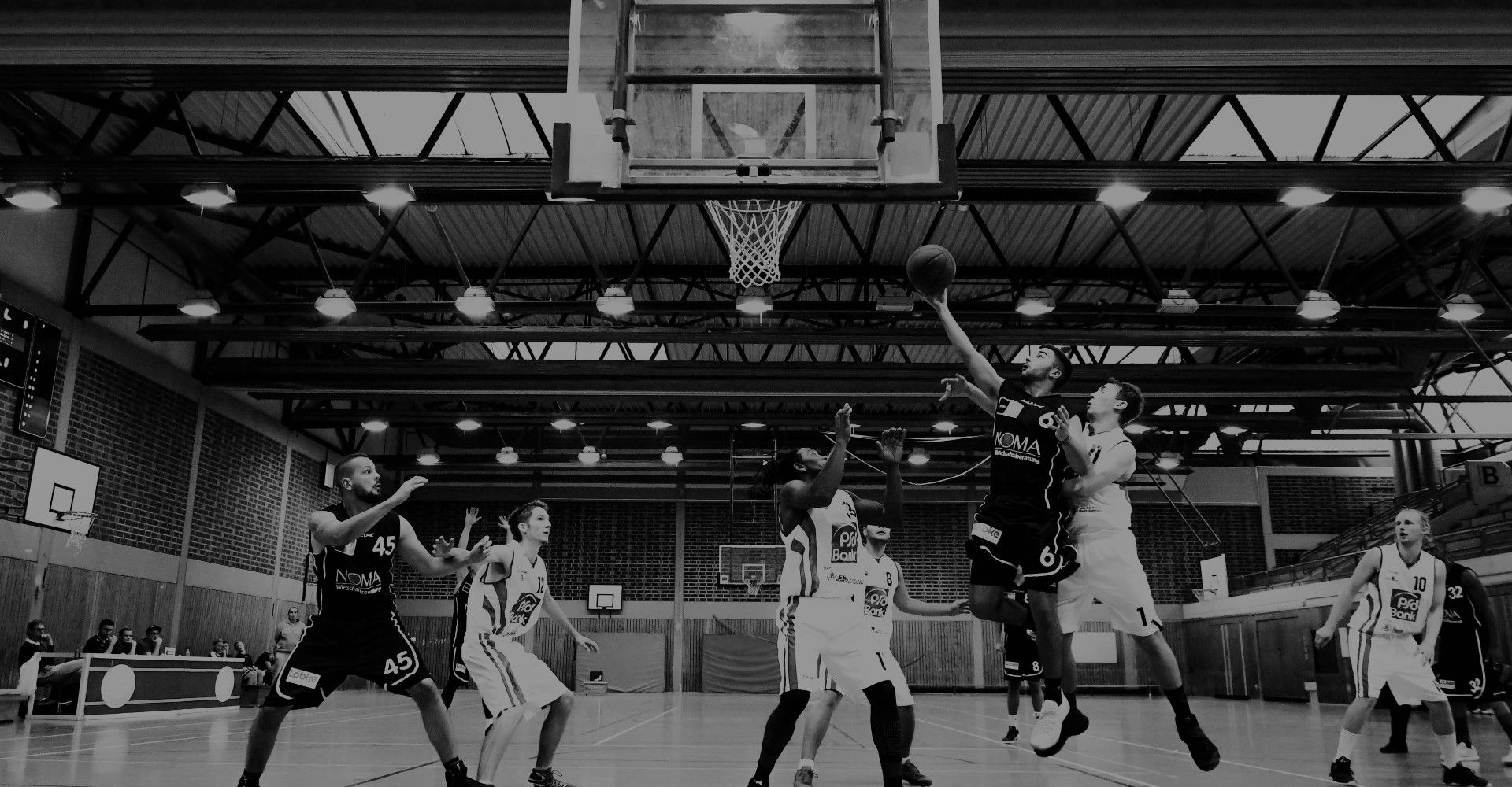 College students playing basketball