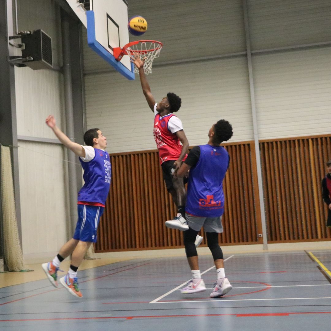 A college student scoring in basketball