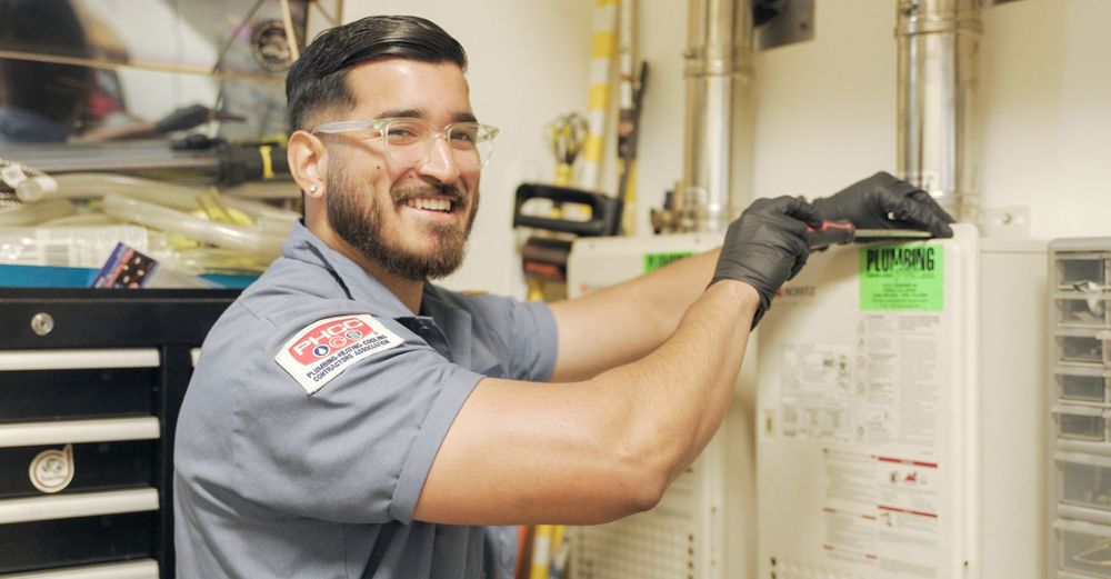 Plumbing Plus working on water heater