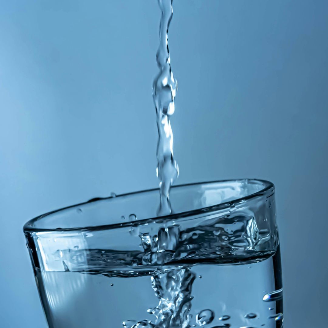 Water flowing into clean glass