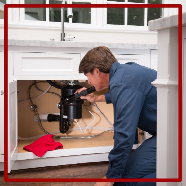 A dedicated plumber performs a detailed inspection of a garbage disposal with a flashlight to diagnose an issue in a Blossom Valley kitchen. A dedicated plumber performs a detailed inspection of a garbage disposal with a flashlight to diagnose an issue in a Blossom Valley kitchen.
