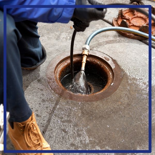 A professional plumber uses a high-pressure hydro-jetting tool to clean a main drain line for a home in San Diego. A professional plumber uses a high-pressure hydro-jetting tool to clean a main drain line for a home in San Diego.