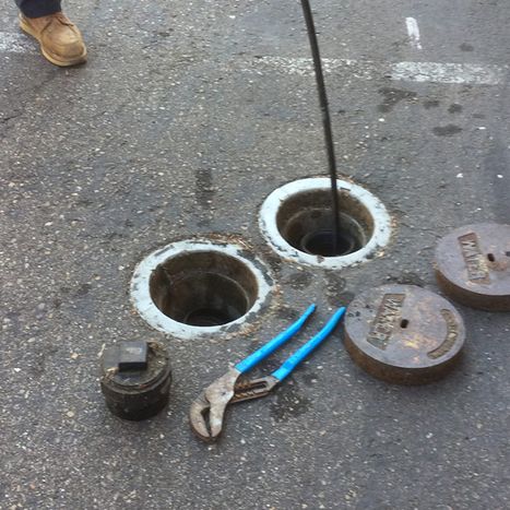 image of a drain being cleaned