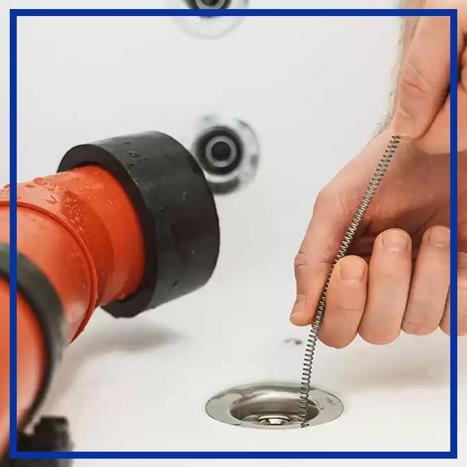 Image of a drain being cleaned