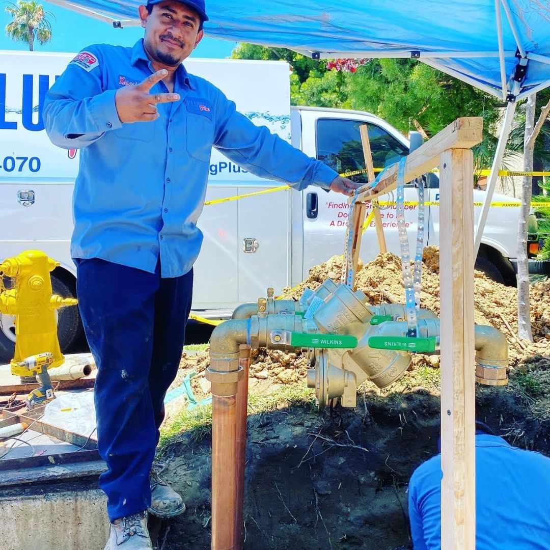 Plumbing Plus tech at job site