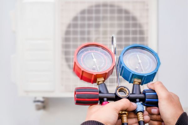 Experienced HVAC technician diagnosing a residential heating system during an emergency repair call. Certified HVAC Technicians Specializing in AC & Furnace Repairs
