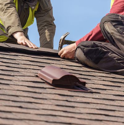 2 workers on a roof