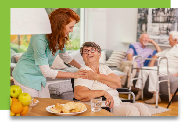 staff attending to senior woman in adult day care facility