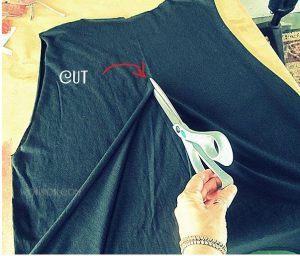 image of scissors cutting through a shirt