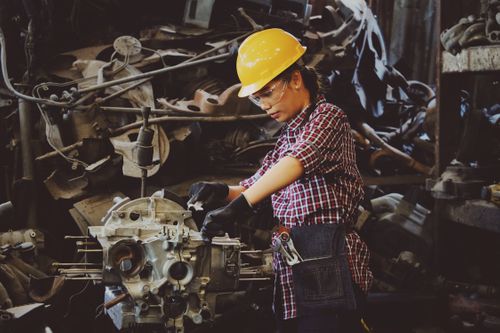 woman working on an engine