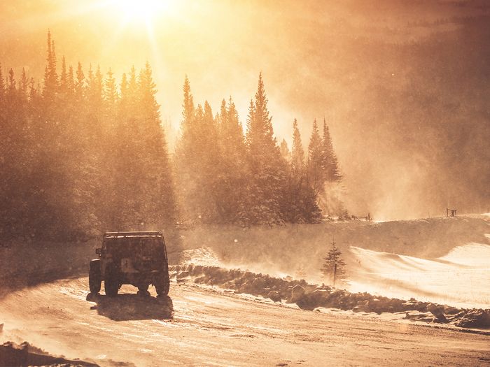 Jeep driving in the mountains in winter