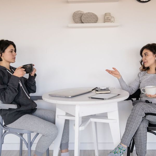 Two woman speaking