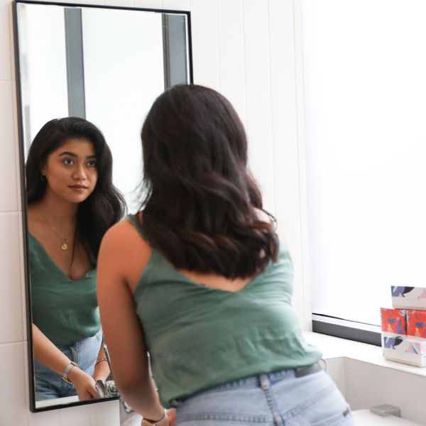 Woman staring at herself in the mirror