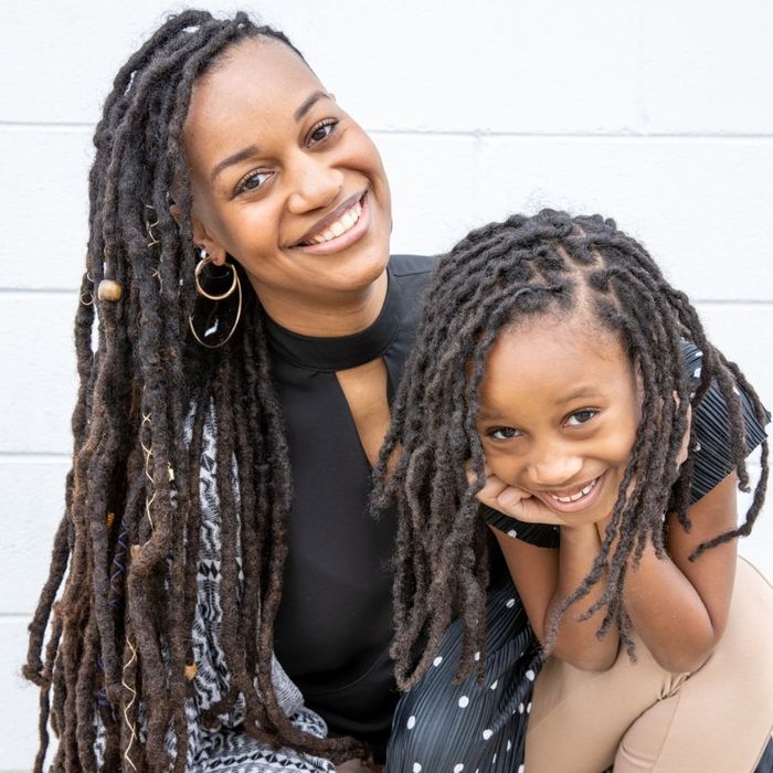 smiling girl with her mother smiling girl with her mother
