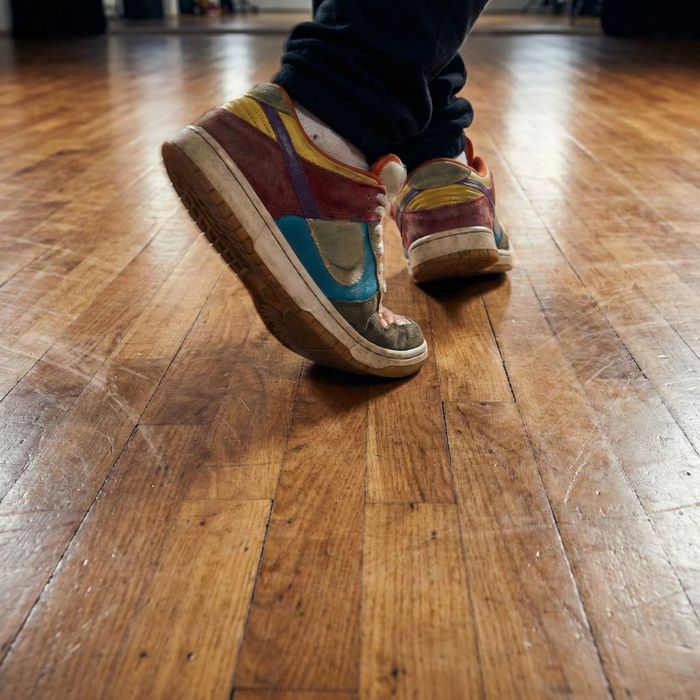 Close up of agile footwork during a hip hop dance lesson.