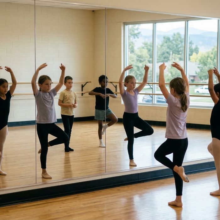 Children in front of a mirror practicing a move