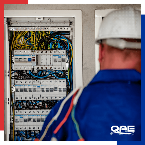 an electrician working on breakers