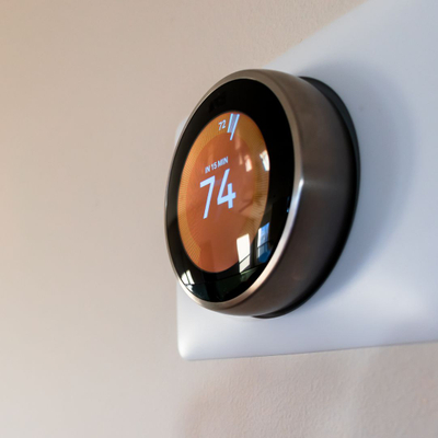modern thermostat displaying 74 degrees.jpg
