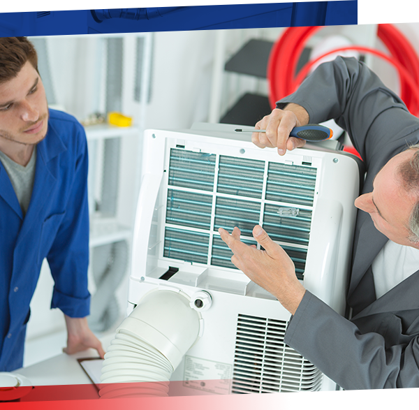 Image of two technicians analyzing an HVAC main unit