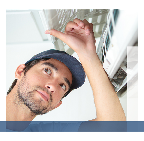 HVAC technician inspecting a unit.