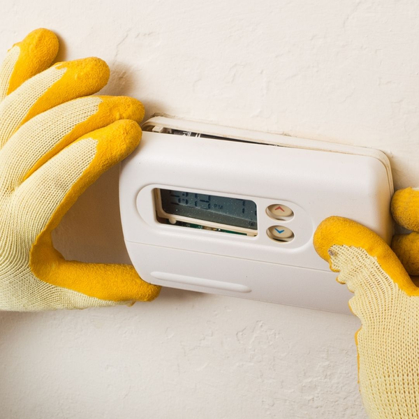 technician replacing thermostat 4 - technician replacing thermostat.jpg