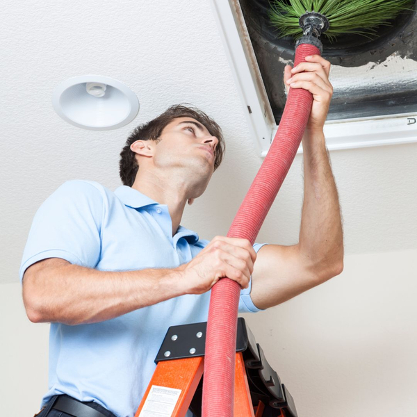 man brushing ducts