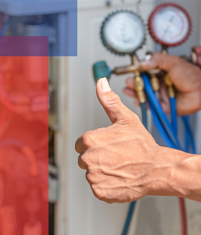 Man checking furnace giving a thumbs up