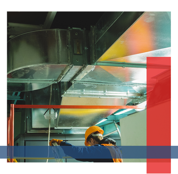 Image of an HVAC contractor working on vents.