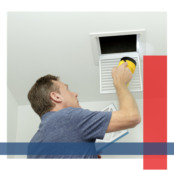 Man inspecting his vents.