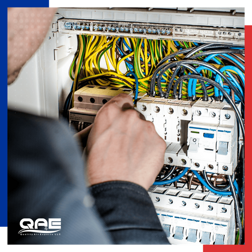 an electrician replacing a fuse