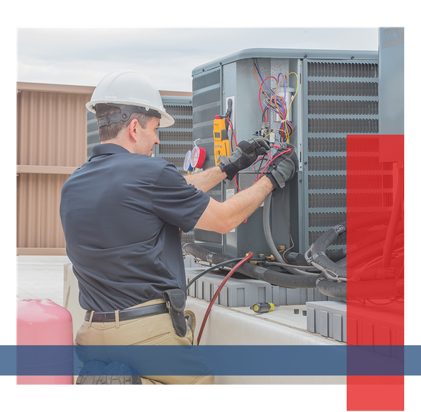 man fixing an AC unit