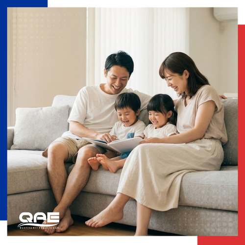 family reading books on couch with children 
