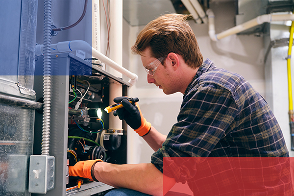 Man inspecting a commercial grade furnace