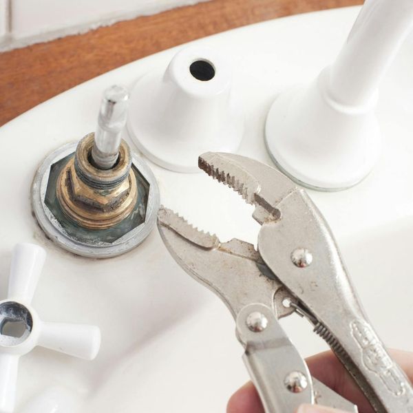 handyman working on plumbing handyman working on plumbing