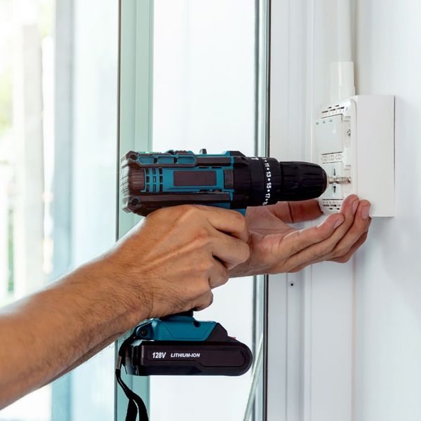 handyman using cordless drill