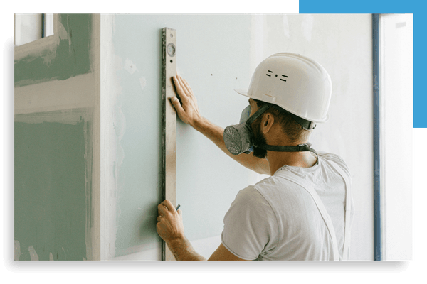 contractor making sure drywall is level