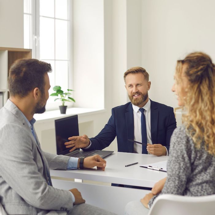 An insurance agent meeting with clients