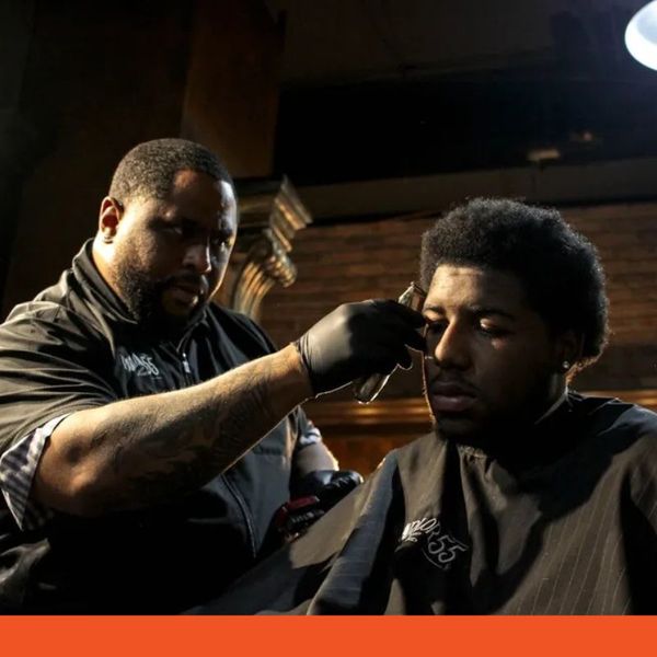 barber trimming afro