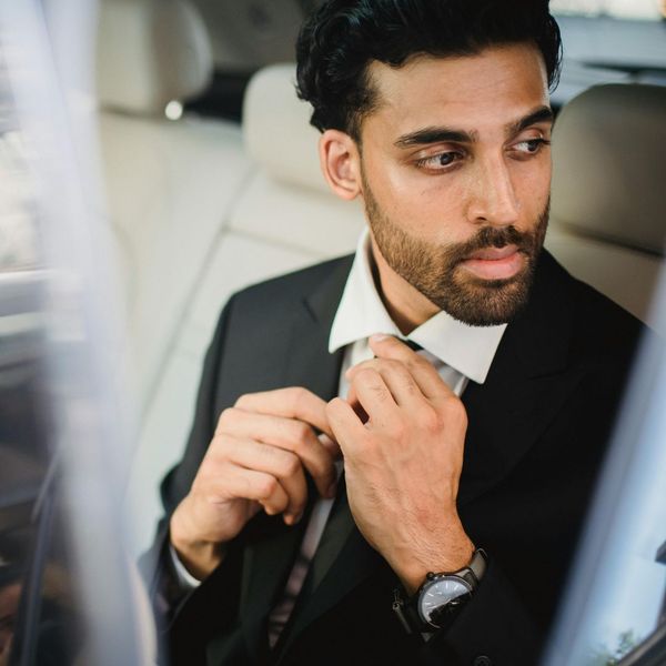 well groomed man wearing suit in a car well groomed man wearing suit in a car