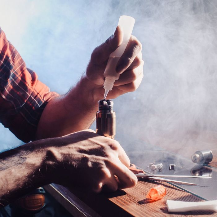 Putting drops into a vape coil